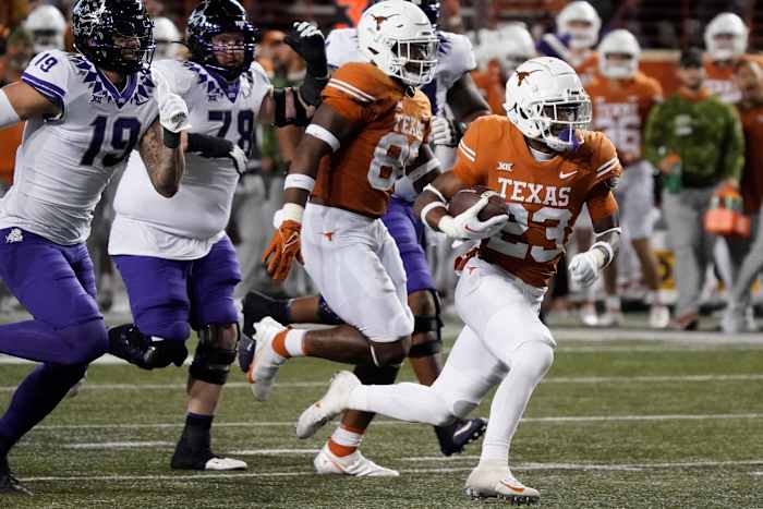 Texas Longhorns defensive back Jahdae Barron (23) runs for a touchdown after recovering a fumble against the Texas Christian Horned Frogs during the second half at Darrell K Royal-Texas Memorial Stadium